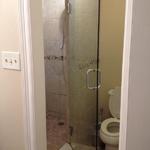 Shower tub removed and made walk in shower with floating glass door.  HOT!